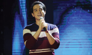 Hero Angeles singing in a videoke TV show with Pag-asa as his partner beneficiary.